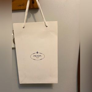 Prada paper bag measures 7 1/2” x 11 1/2” x 2 3/4”.❤️🥰🌹perfect condition 🥰